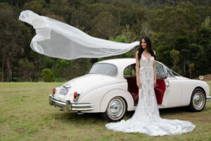 Classic wedding photos with a beatiful Daimler Saloon