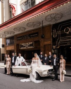 Bridal party posing with stunning classic Mustang Convertible in Sydney