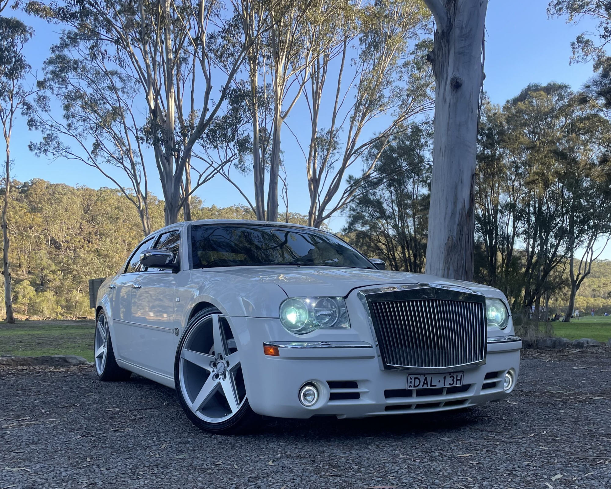 Chauffeur driven executive luxury sedan arriving at a Sydney formal venue