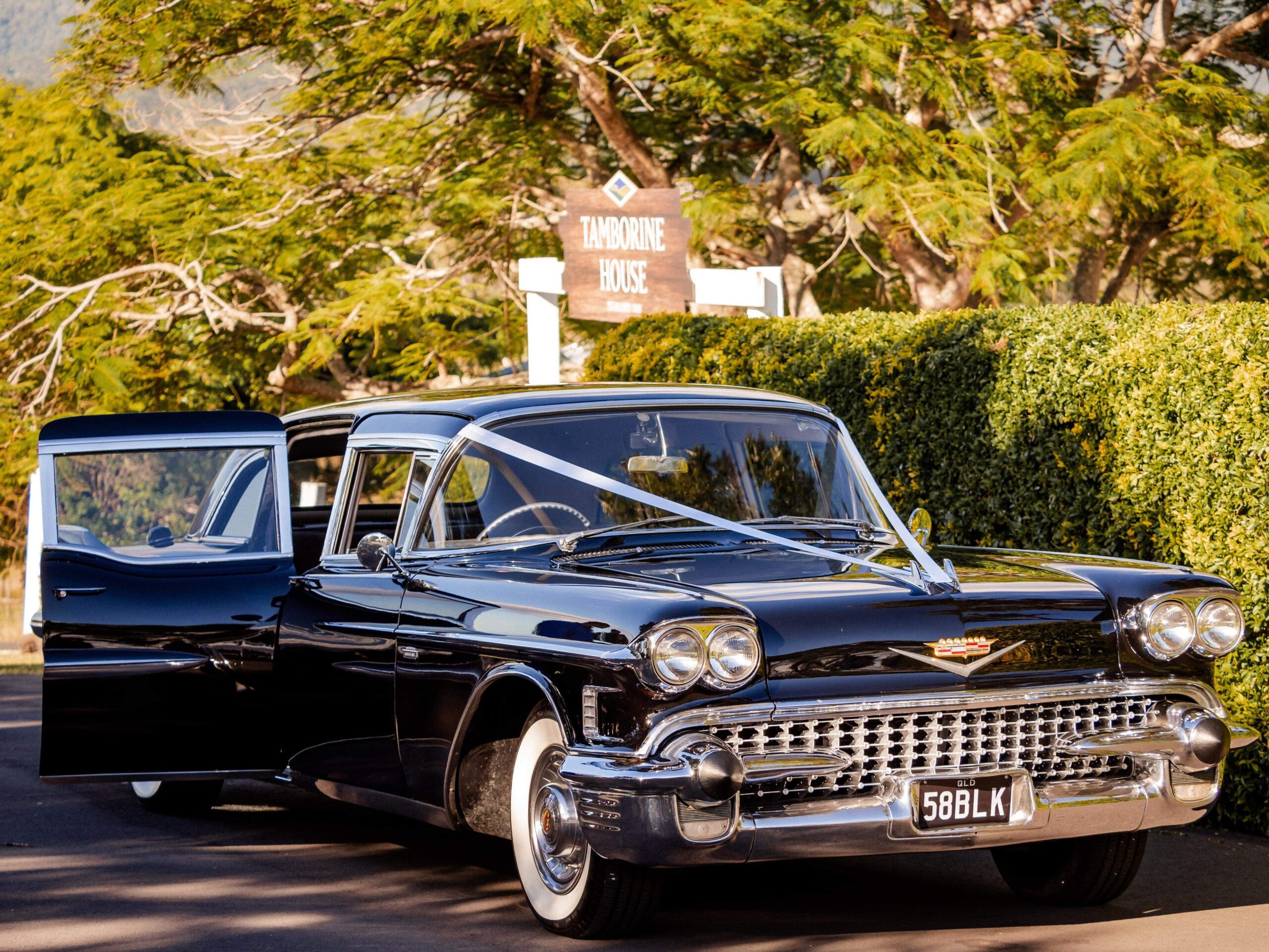 Classic 1958 Cadillac Fleetwood 75 Series Betty stretch limousine parked for Gold Coast school formal hire